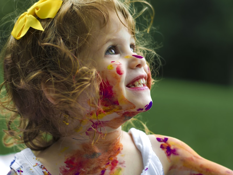 Child engaged in play-based therapy session with colorful toys